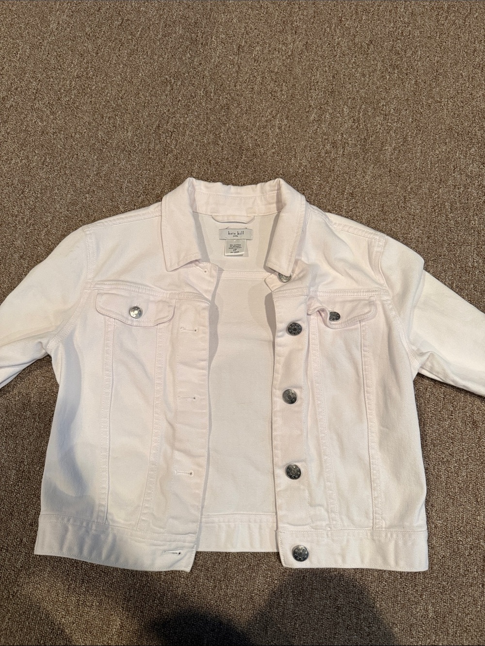 White denim jacket with silver buttons